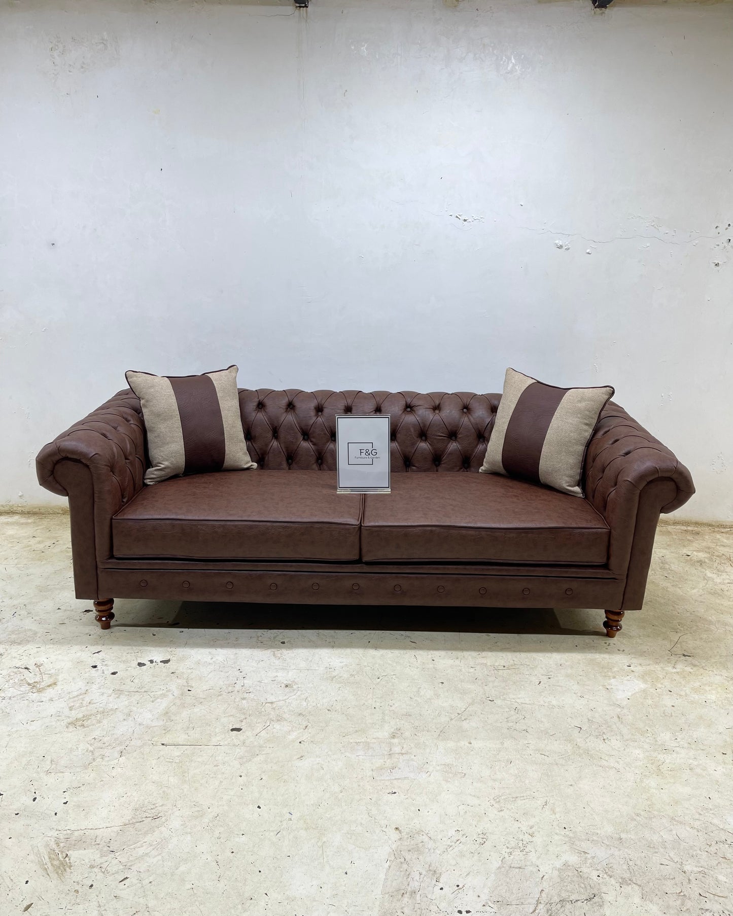 The Victoria Chesterfield Sofa in leather fabric